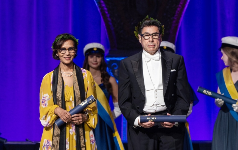 Philippe Aghion tillsammans med samhällsvetenskapliga fakultetens andra nya hedersdoktor Gita Mishra